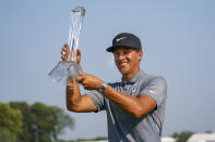 Cameron Champ holds up the 3M Open trophy after winning the 3M Open golf tournament in Blaine, Minn., Sunday, July 25, 2021. (AP Photo/Craig Lassig)