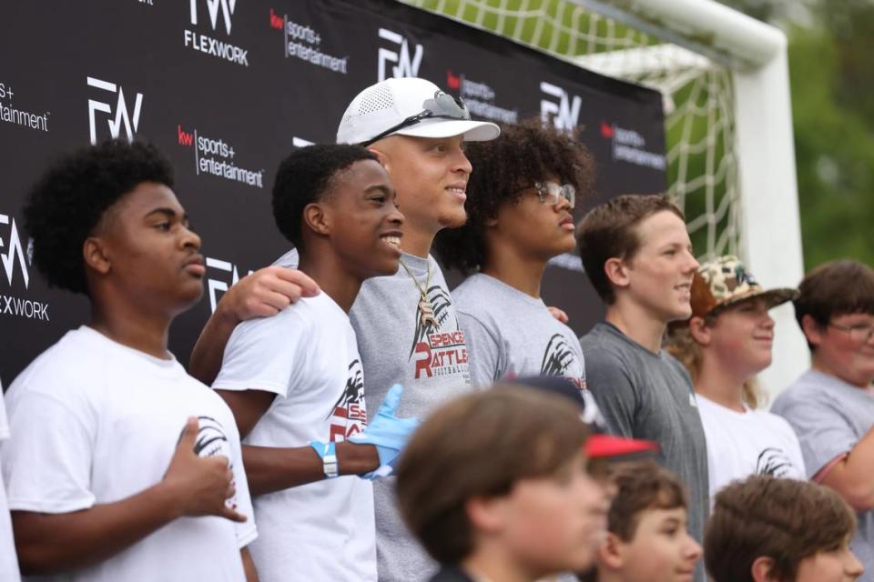 South Carolina quarterback Spencer Rattler works with kids attending the Spencer Rattler FlexWork Football Camp at Dreher High School in Columbia on Saturday, May 20, 2023.