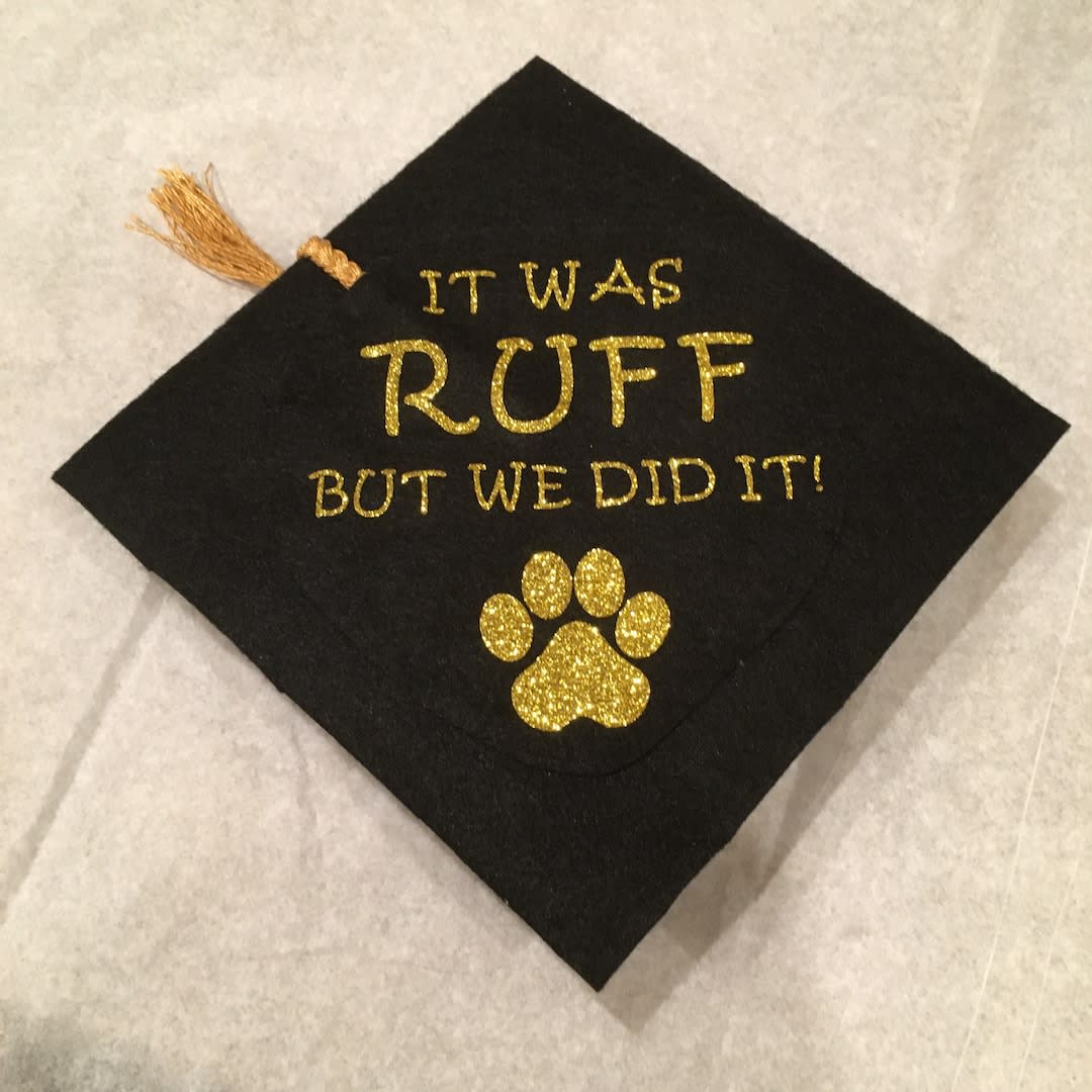 <p><a href="https://go.redirectingat.com?id=74968X1596630&url=https%3A%2F%2Fwww.etsy.com%2Flisting%2F797783579%2Fdog-graduation-hat-cap-it-was-ruff-with&sref=https%3A%2F%2Fwww.thepioneerwoman.com%2Fhome-lifestyle%2Fcrafts-diy%2Fg39693817%2Fgraduation-cap-ideas%2F" rel="nofollow noopener" target="_blank" data-ylk="slk:Shop Now;elm:context_link;itc:0;sec:content-canvas" class="link rapid-noclick-resp">Shop Now</a></p><p>'It Was Ruff But We Did It!' Graduation Cap</p><p>etsy.com</p><p>$21.00</p><span class="copyright">Pet Dog Trainer</span>