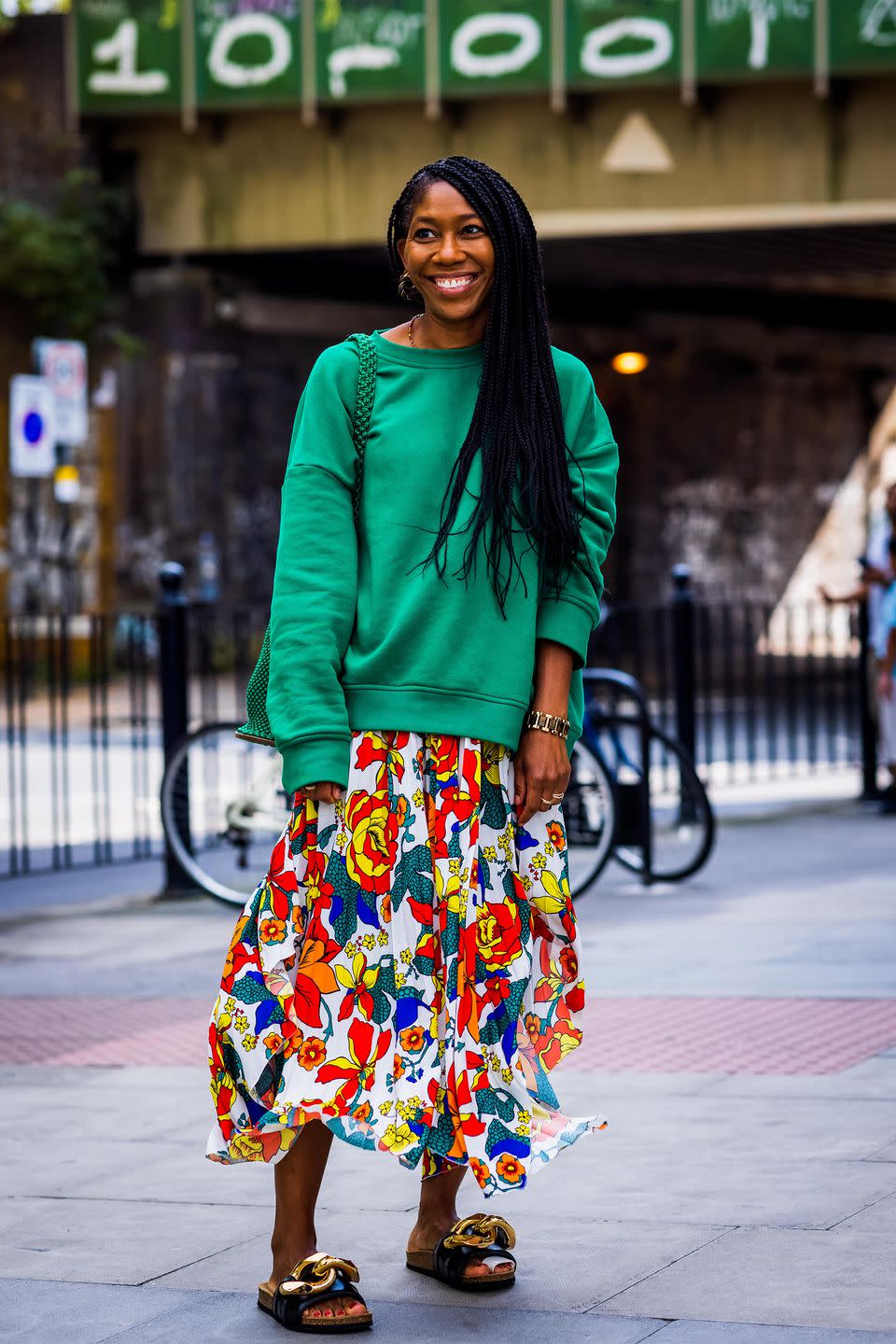 <p>We love a floral with a sweatshirt and JW Anderson sandals.</p>