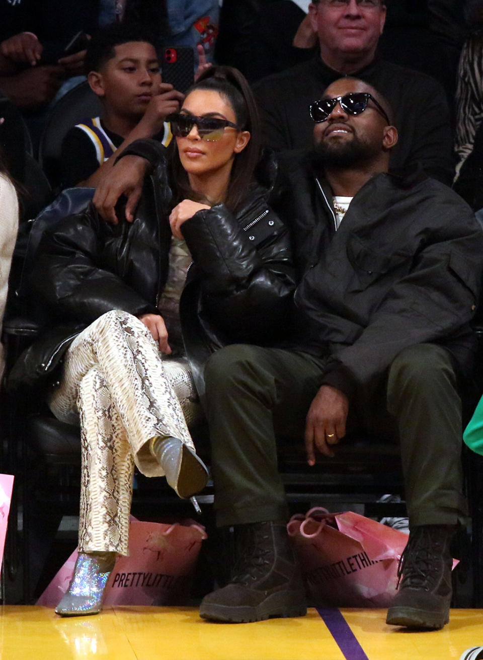 Kim Kardashian and Kanye West sit courtside at the Lakers game on Jan. 13. - Credit: Courtesy of Splash