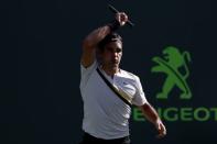 Mar 24, 2018; Key Biscayne, FL, USA; Roger Federer of Switzerland hits a forehand against Thanasi Kokkinakis of Australia (not pictured) on day five of the Miami Open at Tennis Center at Crandon Park. Kokkinakis won 3-6, 6-3, 7-6(4). Mandatory Credit: Geoff Burke-USA TODAY Sports