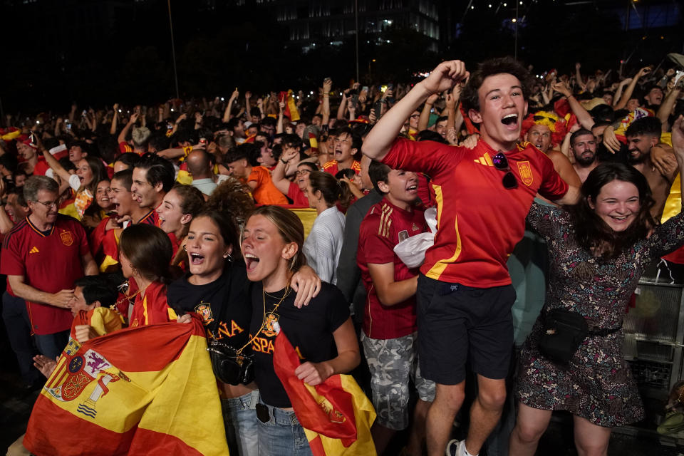 Spain supporters celebrate in Madrid, Spain, July 14, 2024 during the screening of the final match between Spain and England at the Euro 2024 soccer tournament in Berlin Germany. (AP Photo/Andrea Comas)