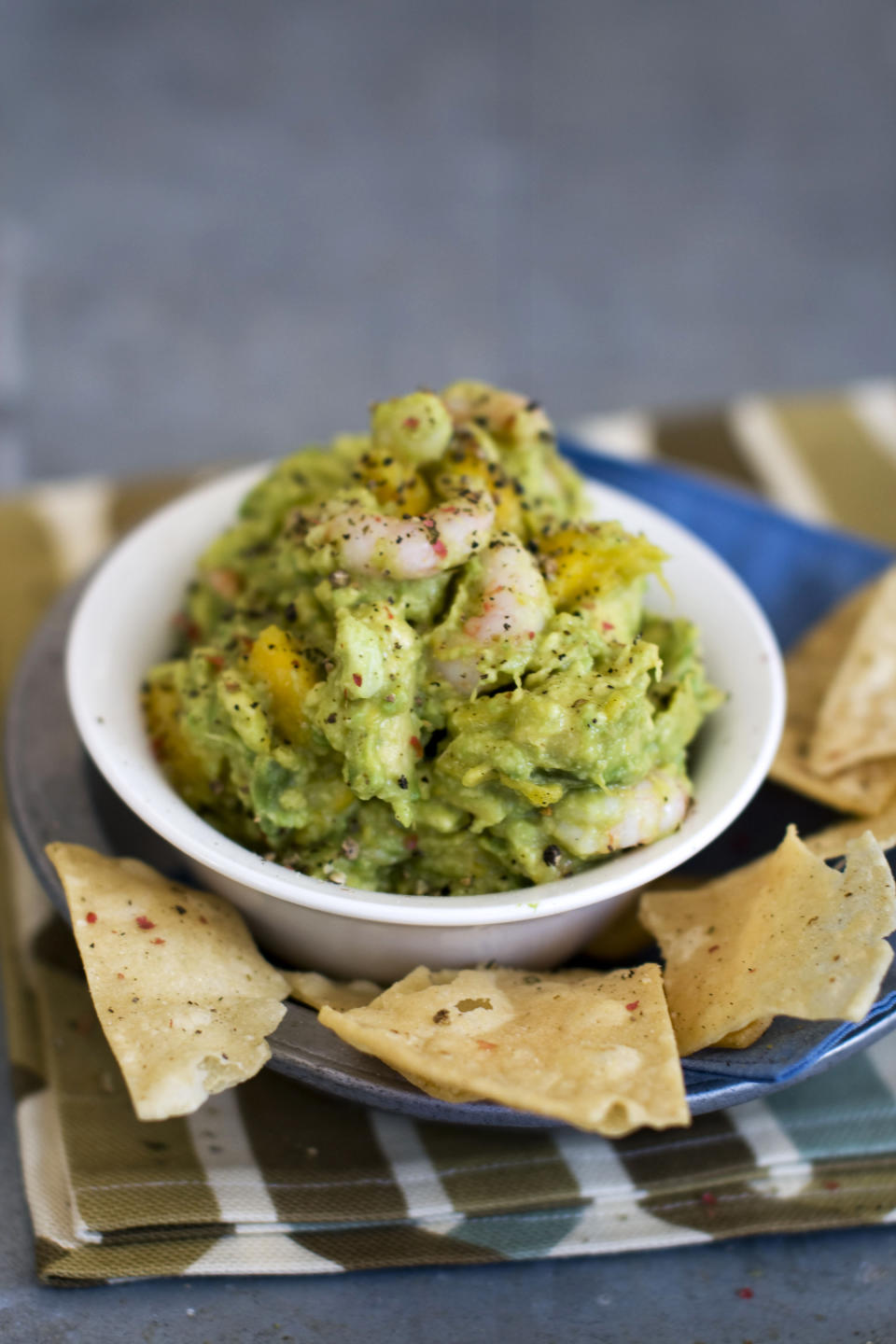 In this image taken on January 7, 2013, shrimp and mango guacamole is shown served in a bowl in Concord, N.H. (AP Photo/Matthew Mead)