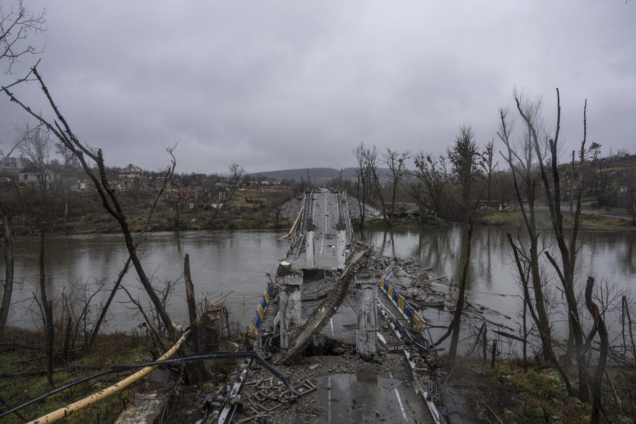 A destroyed bridge across Siverskyi-Donets river is seen in the village of Bogorodychne, Ukraine, Friday, Jan. 6, 2023. (AP Photo/Evgeniy Maloletka)