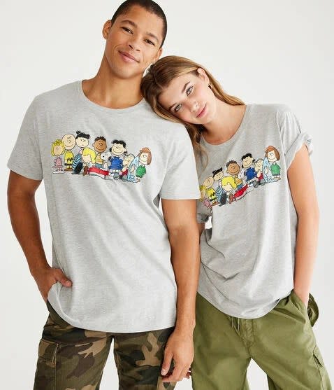 models wearing gray graphic t-shirt of snoopy & friends