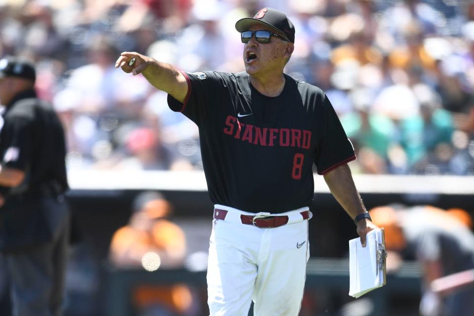 Stanford head coach David Esquer reacts to Tennessee's first run during the NCAA Baseball College World Series in Omaha, Nebraska, on Monday, June 19, 2023. 