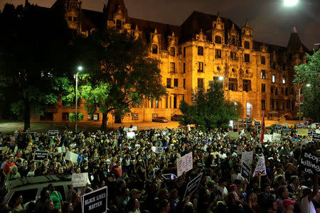 Demonstrators continue to protest for a fourth day after the not guilty verdict in the murder trial of Jason Stockley, a former St. Louis police officer, charged with the 2011 shooting of Anthony Lamar Smith, who was black, in St. Louis, Missouri, U.S., September 18, 2017. REUTERS/Joshua Lott