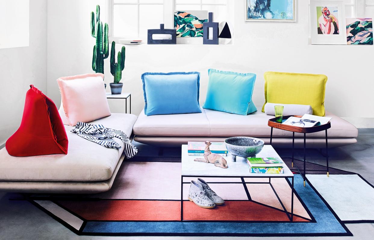  A living room filled with bold colors. 