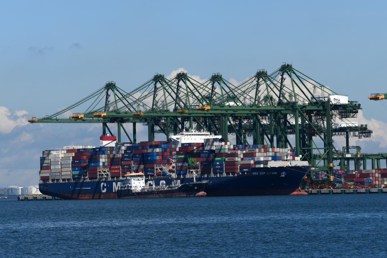 A container vessel is docked at the port in Singapore.