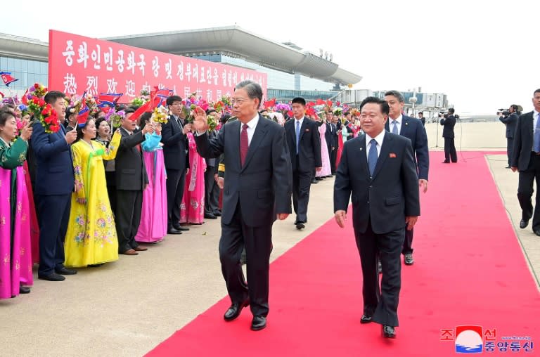 China's top lawmaker Zhao Leji (centre L) walks with Choe Ryong Hae (R), chairman of North Korea's Standing Committee of the Supreme People's Assembly on April 11 (STR)