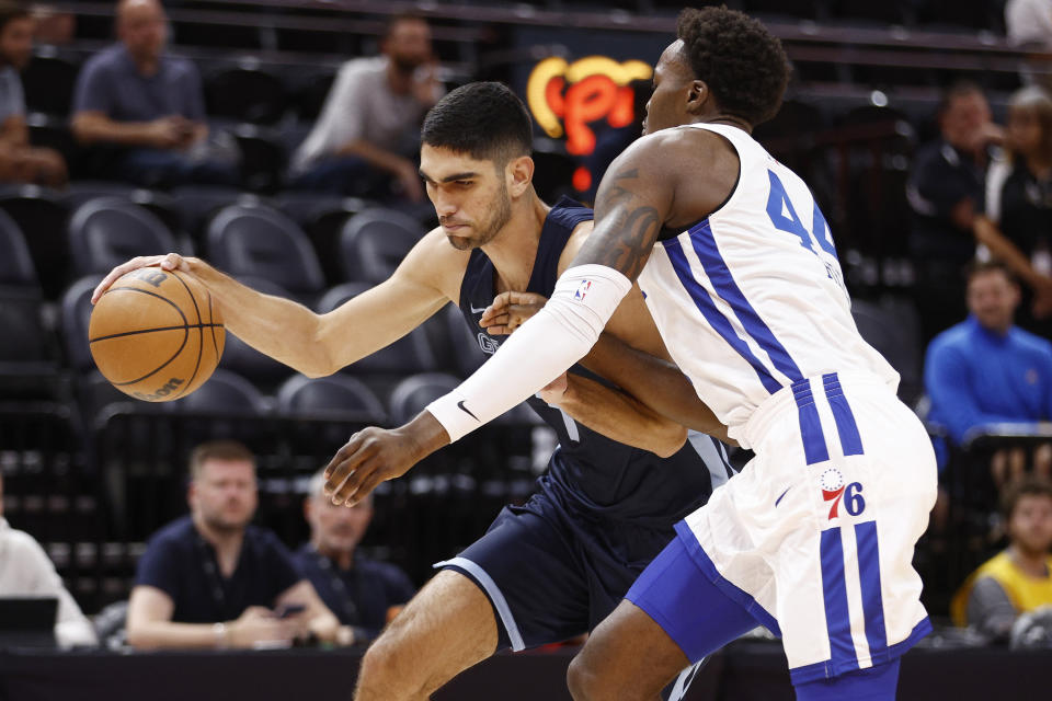 Memphis Grizzlies forward Santi Aldama (7) drives against Philadelphia 76ers forward Paul Reed Jr. (44) during the first quarter of an NBA summer league basketball game Tuesday, July 5, 2022, in Salt Lake City. (AP Photo/Jeff Swinger)