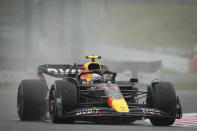 Red Bull driver Sergio Perez of Mexico powers his car during first practice session for the Japanese Formula One Grand Prix at the Suzuka Circuit in Suzuka, central Japan, Friday, Oct. 7, 2022. (AP Photo/Toru Hanai)