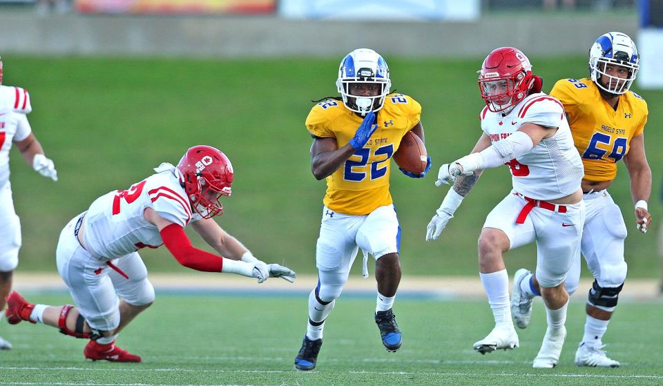 Alfred Grear (22) rushes the ball for Angelo State University during a game against Simon Fraser on Saturday, Oct. 23, 2021.