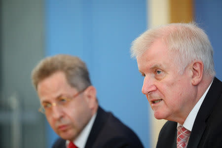 FILE PHOTO: German Interior Minister Horst Seehofer and Hans-Georg Maassen, President of the Federal Office for the Protection of the Constitution, attend a news conference in Berlin, Germany July 24, 2018. REUTERS/Hannibal Hanschke/File Photo