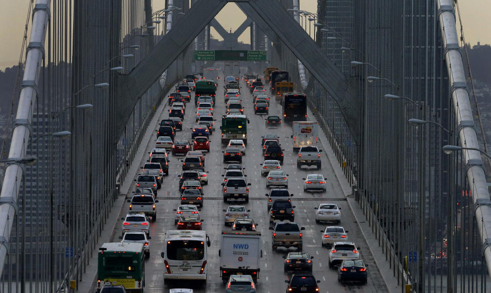 FILE - In this Dec. 10, 2015, file photo, vehicles make their way westbound on Interstate 80 across the San Francisco-Oakland Bay Bridge as seen from Treasure Island in San Francisco. California Gov. California regulators will hold a public hearing on Thursday, Dec. 12, 2019 about whether to require a certain percentage of truck sales to be zero emission vehicles. California has some of the worst air quality in the nation, largely driven by pollution from cars and trucks. (AP Photo/Ben Margot, File)