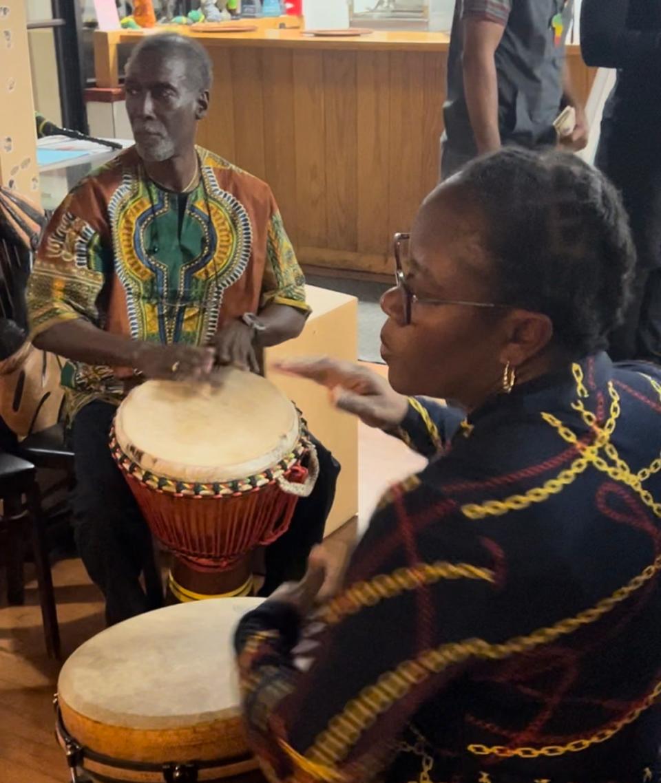 Earl Simmons, cofounder of the Nguzo Saba Collective that organizes the annual Kwanzaa on the Space Coast, offers a chance for attendees - especially youth - to play on traditional African drums.