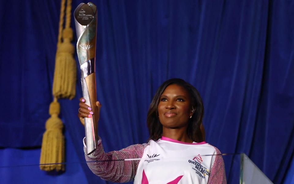 Denise Lewis carries the Queens Baton during the opening ceremony - REUTERS