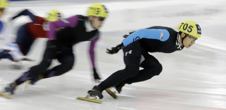 J. R. Celski, right, leads the pack as he competes in the men's 1,000 meters during the U.S. Olympic short track speedskating trials Sunday, Jan. 5, 2014, in Kearns, Utah. (AP Photo/Rick Bowmer)