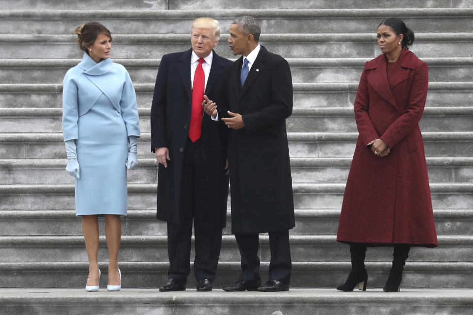 President Trump and former President Barack Obama stand on the steps of the U.S. Capitol with first lady Melania Trump and former first lady Michelle Obama, Jan. 20, 2017. (Photo by Rob Carr/Getty Images)