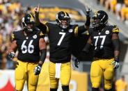 FILE PHOTO: Sep 20, 2015; Pittsburgh, PA, USA; Pittsburgh Steelers quarterback Ben Roethlisberger (7) celebrates a touchdown pass with guard David DeCastro (66) and offensive tackle Marcus Gilbert (77) against the San Francisco 49ers during the first half at Heinz Field. Jason Bridge-USA TODAY Sports / Reuters Picture Supplied by Action Images