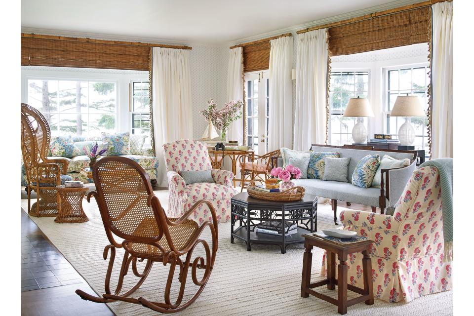 <p>Wanting to match the structure's beautiful bones with more of an old-soul than new-vacation-home feel (and do so in an ambitious four months so the family could be in by summer), Kathleen called on designer <a href="https://www.coastalliving.com/homes/decorating/amanda-lindroth-island-hopping" rel="nofollow noopener" target="_blank" data-ylk="slk:Amanda Lindroth;elm:context_link;itc:0;sec:content-canvas" class="link ">Amanda Lindroth</a>. Known for her vibrant waterfront projects in Palm Beach, Harbour Island, and beyond, Lindroth's use of color and pattern resonated with Kathleen. Plus, there was the matter of spearheading a project in a remote coastal locale. "I thought to myself, "This woman does islands. She gets the crazy logistics of moving everything in by boat,"" Kathleen says. "I knew she wouldn't be daunted."</p> <p><em>Pictured: Multiple seating vignettes make for an inviting living room, but what really bumps up the cozy factor is the <a href="https://peterfasano.com/" rel="nofollow noopener" target="_blank" data-ylk="slk:Peter Fasano;elm:context_link;itc:0;sec:content-canvas" class="link ">Peter Fasano</a> block-print wallpaper, which quietly adds depth and dimension.</em></p>