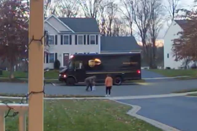 <p>Lillian May</p> UPS driver Frank Sims and toddler Owen May share a hug as Sims was making his delivery rounds in Meriden, Connecticut on Nov. 29, 2023