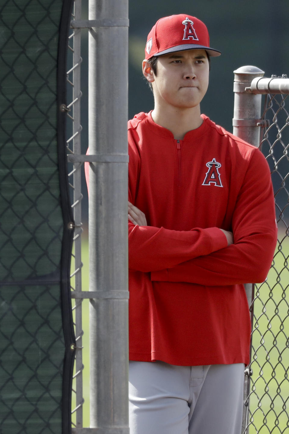 Los Angeles Angels Shohei Ohtani, of Japan, watches pitching practice at their spring baseball training facility in Tempe, Ariz., Friday, Feb. 15, 2019. (AP Photo/Chris Carlson)