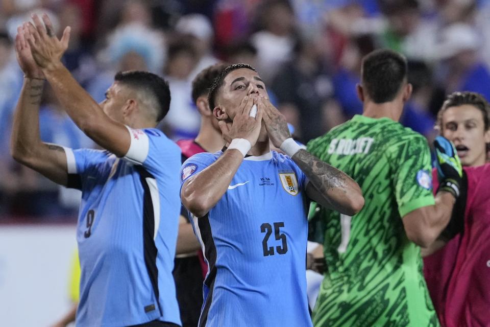 Uruguay's Cristian Olivera (25) reacts after his team defeated the United States in an Copa America Group C soccer match, Monday, July 1, 2024, in Kansas City, Mo. (AP Photo/Ed Zurga)