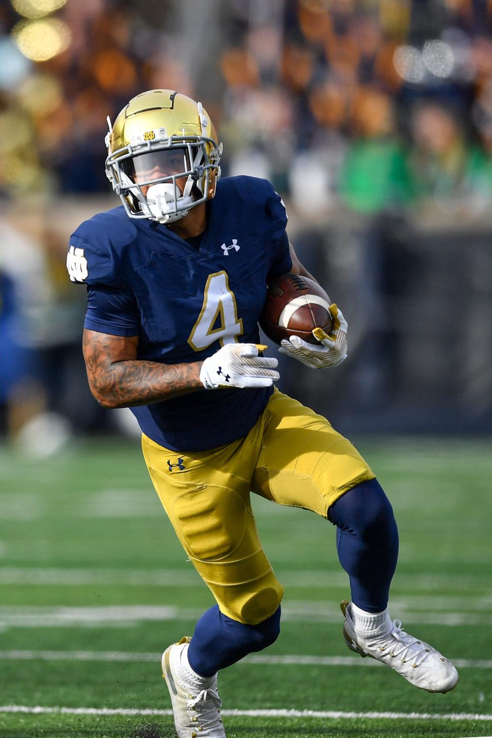 Oct 28, 2023; South Bend, Indiana, USA; Notre Dame Fighting Irish wide receiver Chris Tyree (4) carries against the Pittsburgh Panthers in the first quarter at Notre Dame Stadium. Mandatory Credit: Matt Cashore-USA TODAY Sports