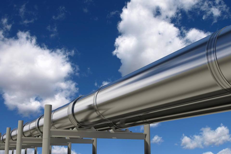 Silver pipelines with a blue sky in the background.