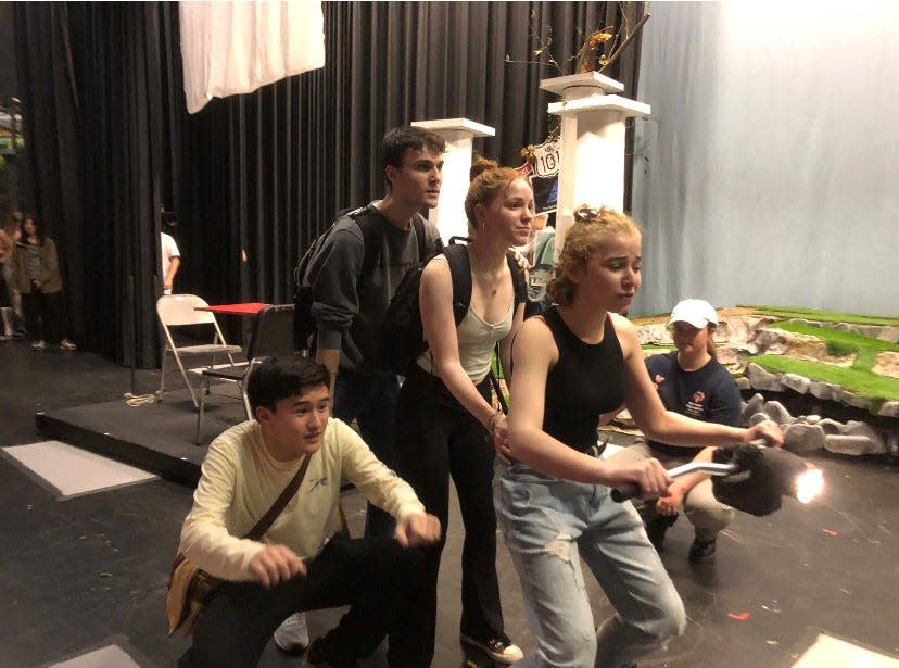 Julia Baker (Ares) helps Zach Hoyer (Percy), Jennifer Burnette (Annabeth) and Gordon Beckler (Grover) get to L.A. on a motorcycle, while Michela Deem helps with special effects, in a rehearsal for "The Lightning Thief" at Briarcliff High School. The Percy Jackson musical plays Briarcliff at 7.30 p.m., March 10, 11; 2:30 p.m. March 12. Tickets are $15 at showtix4u.com.