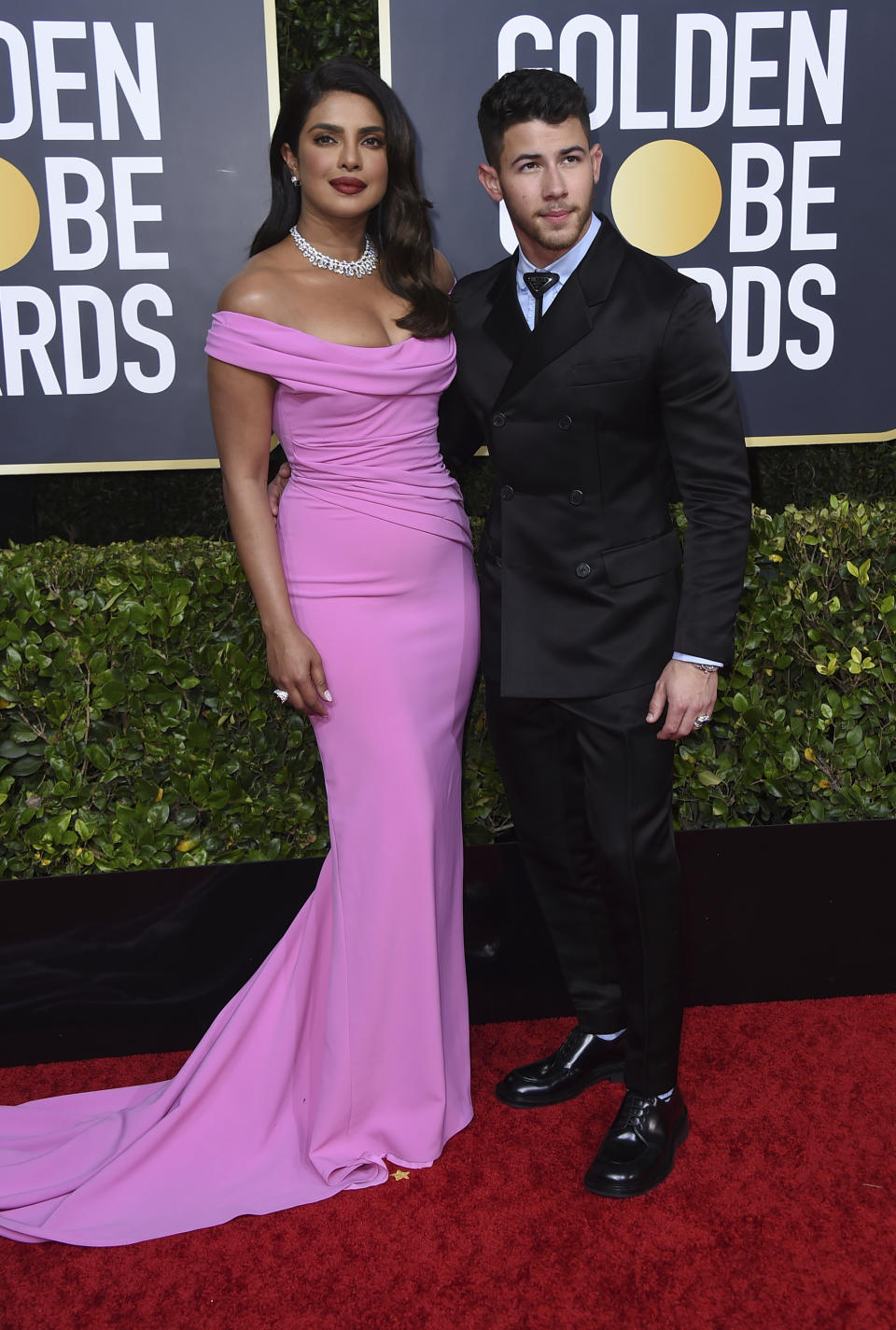 FILE - Priyanka Chopra Jonas, left, and husband Nick Jonas arrive at the 77th annual Golden Globe Awards in Beverly Hills, Calif., on Jan. 5, 2020. Chopra Jonas and Jonas announced on their Instagram pages Friday, Jan. 21, 2022, that they welcomed their first baby together. She said a surrogate gave birth to the couple’s baby on Jan. 15. (Photo by Jordan Strauss/Invision/AP, File)