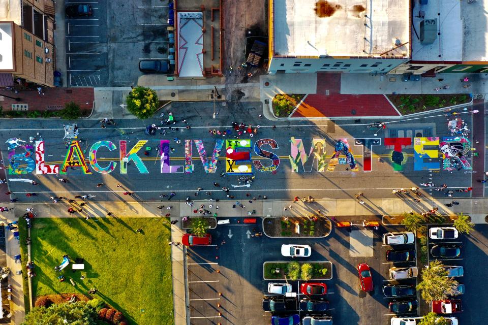 A new Black Lives Matter mural in downtown Spartanburg on West Broad Street features designs from 16 artists. The mural stretches 240 feet down West Broad Street between Church and Spring streets, facing Spartanburg City Hall and the Spartanburg Police Department headquarters.