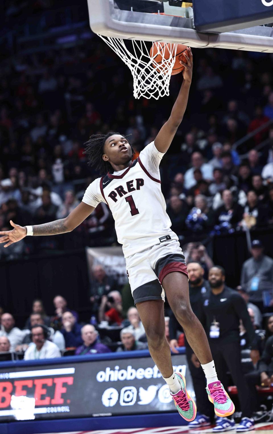 Harvest Prep's Adonus Abrams drives to the basket during the Division III state championship game against Cleveland Heights Lutheran East on Sunday at University of Dayton Arena.