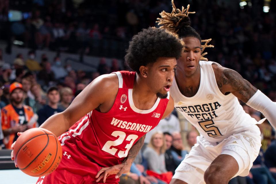 Wisconsin's Chucky Hepburn is defended by Georgia Tech guard Deivon Smith during the first half Wednesday.