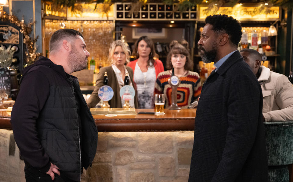 FROM ITV

STRICT EMBARGO
Print media - No Use Before Tuesday 12th December 2023
Online Media - No Use Before 0700hrs Tuesday 12th December 2023

Emmerdale - 9864

Monday 18th December 2023

Aaron Dingle [DANNY MILLER] has an altercation with Chas Dingle [LUCY PARGETER], a seething Charles Anderson [KEVIN MATHURIN] orders Aaron to show his mother respect. But when Aaron goads him, a scuffle ensues. 

Picture contact - David.crook@itv.com

Photographer - Mark Bruce

This photograph is (C) ITV and can only be reproduced for editorial purposes directly in connection with the programme or event mentioned above, or ITV plc. This photograph must not be manipulated [excluding basic cropping] in a manner which alters the visual appearance of the person photographed deemed detrimental or inappropriate by ITV plc Picture Desk. This photograph must not be syndicated to any other company, publication or website, or permanently archived, without the express written permission of ITV Picture Desk. Full Terms and conditions are available on the website www.itv.com/presscentre/itvpictures/terms
