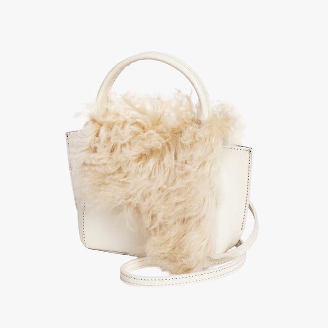 That shearling coat you love? It comes in accessory form, too. Here, we found the season’s coziest shearling bags and shoes—your extremities will thank you.