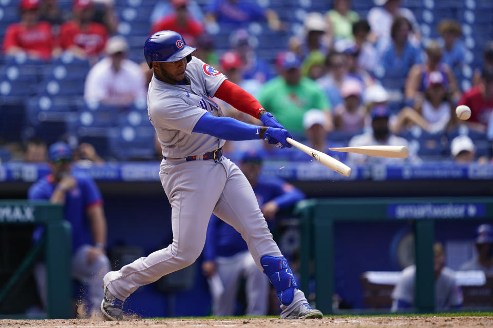 Chicago Cubs' Nelson Velazquez breaks his bat as he hits a single off Philadelphia Phillies' Jeurys Familia during the ninth inning of a baseball game, Sunday, July 24, 2022, in Philadelphia. (AP Photo/Matt Rourke)