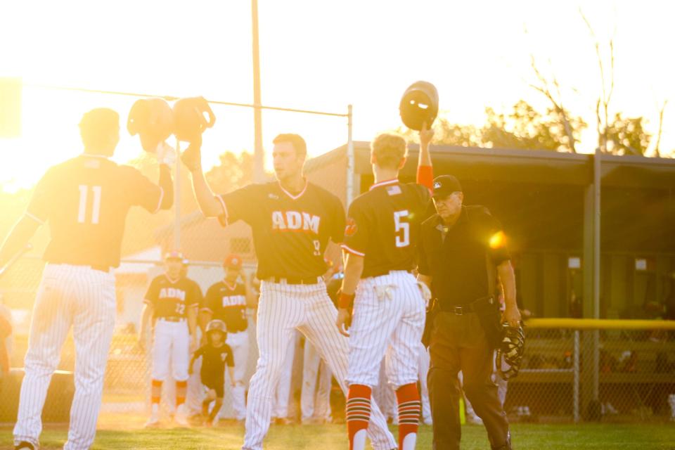 Grant Rychnovsky (9) celebrates his home run with Grant Jansen (11) and Rhylan Stine-Smith (5) on Thursday, June 6, 2024.