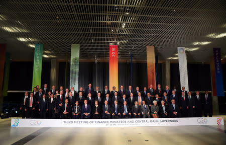 Finance ministers and Central Bank presidents pose for the official photo at the G20 Meeting of Finance Ministers in Buenos Aires, Argentina, July 21, 2018. REUTERS/Marcos Brindicci