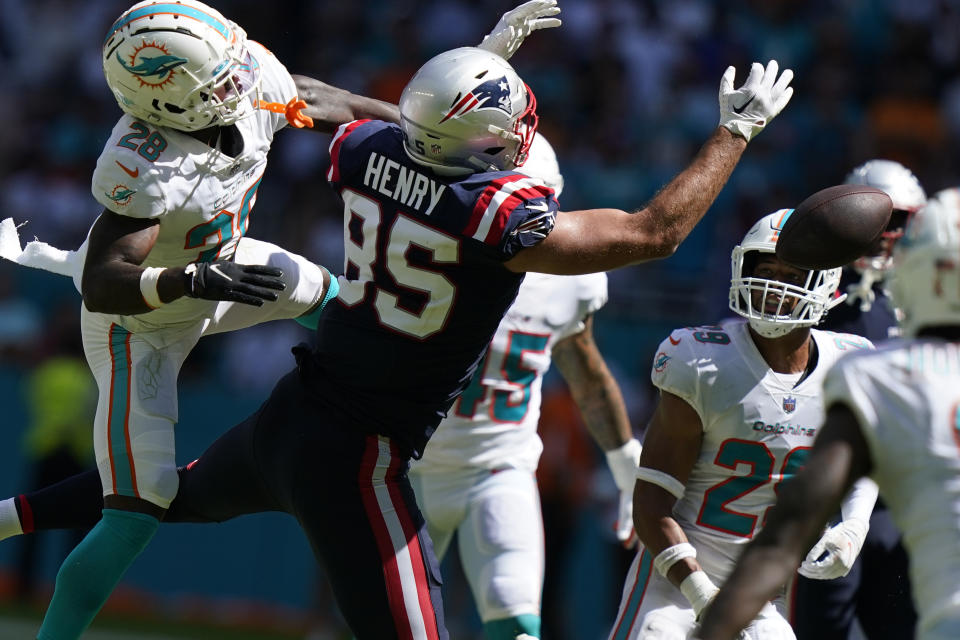 New England Patriots tight end Hunter Henry (85) can't hold on to a pass under pressure from Miami Dolphins cornerback Kader Kohou (28) during the second half of an NFL football game, Sunday, Sept. 11, 2022, in Miami Gardens, Fla. (AP Photo/Lynne Sladky)