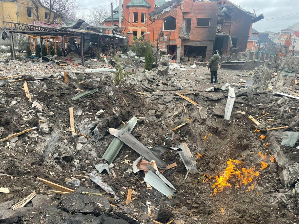 Debris are scattered around the hole in a road at the site where several houses have been damaged by an explosion, following an air strike in Bila Tserkva, Kyiv Oblast, Ukraine March 5, 2022 in this picture obtained from social media. Kyiv Oblast Police/Handout via REUTERS    THIS IMAGE HAS BEEN SUPPLIED BY A THIRD PARTY