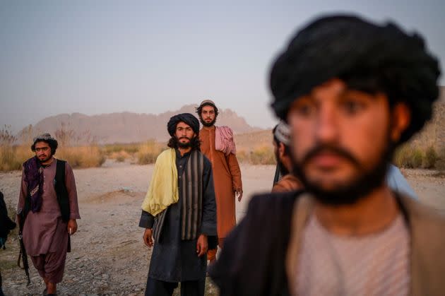 In this picture taken on September 23, 2021, Taliban members enjoy an afternoon on the banks of a river in Kandahar. (Photo by Bulent KILIC / AFP) (Photo by BULENT KILIC/AFP via Getty Images) (Photo: BULENT KILIC via Getty Images)