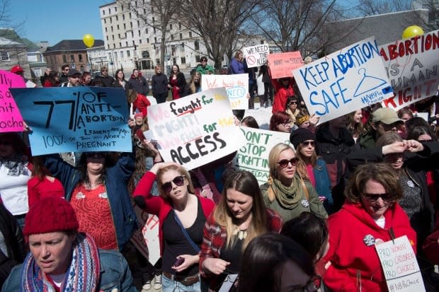 Pro-choice demonstrators rally at the New Brunswick Legislature in Fredericton on Thursday, April 17, 2014. (David Smith/The Canadian Press - image credit)