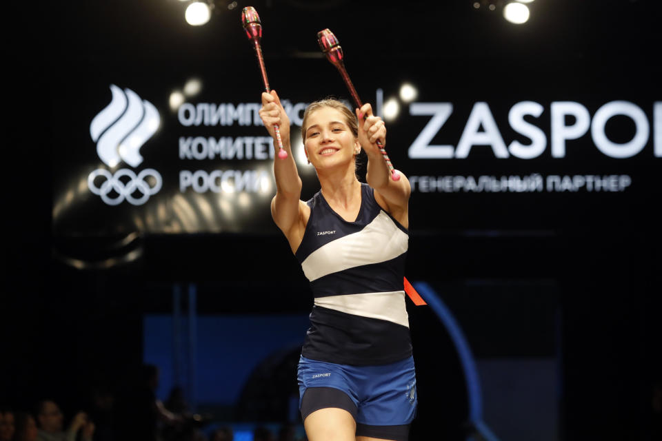 A model displays the Olympic uniforms for Russian athletes in Moscow, Russia, Wednesday, April 14, 2021. Russia presents its Olympic kit for the Tokyo Games, which shouldn't depict any symbols of the country. Russian athletes will compete at the Tokyo Olympics as neutral after the Court of Arbitration for Sport last December banned Russia from using its name, flag and anthem at any world championships for the next two years because of state-backed doping. (AP Photo/Pavel Golovkin)