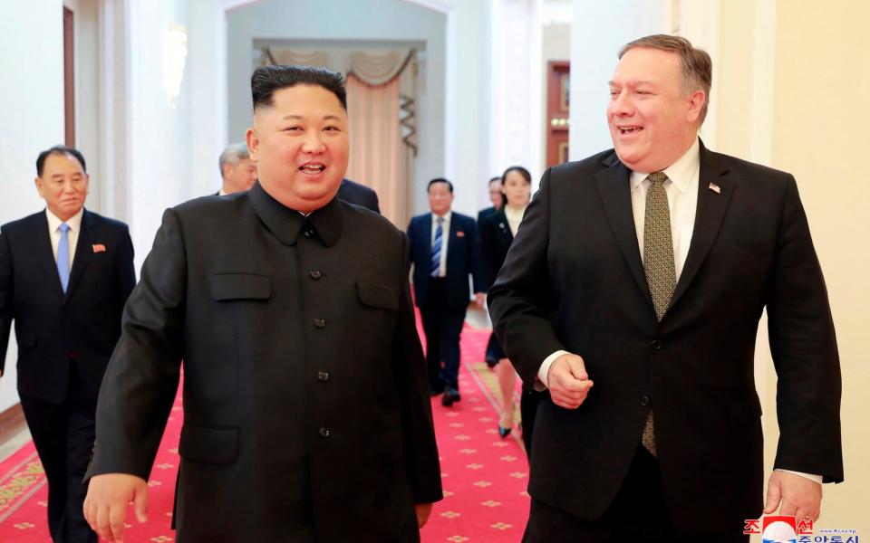 Kim Jong-un and US Secretary of State Mike Pompeo walk together before their meeting in Pyongyang, North Korea, Sunday, October 7 - KCNA via KNS