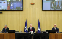 NATO Secretary General Jens Stoltenberg, center, speaks during a video conference of NATO Defense Minister at the NATO headquarters in Brussels, Wednesday, June 17, 2020. NATO Defense Ministers began two days of video talks focused on deterring Russian aggression and a US decision to withdraw thousands of troops from Germany. (Francois Lenoir, Pool Photo via AP)