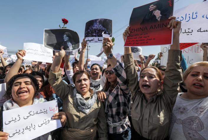 <div class="inline-image__caption"><p>Women chant slogans and hold up signs depicting the image of 22-year-old Mahsa Amini, who died while in the custody of Iranian authorities, during a demonstration outside the UN offices in Arbil, the capital of Iraq's autonomous Kurdistan region.</p></div> <div class="inline-image__credit">Safin Hamed</div>