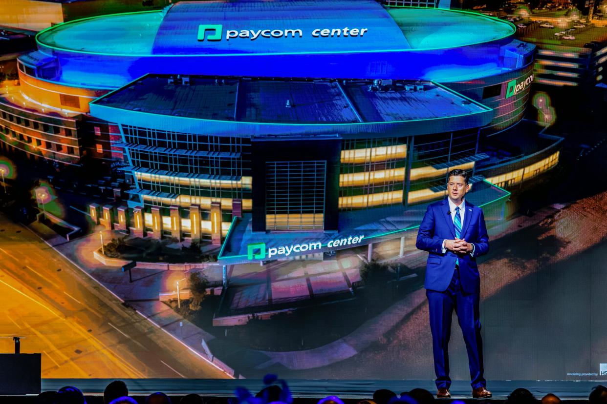 With an image of the Paycom Center in the background, Oklahoma City Mayor David Holt speaks in July at the State of the City address. A proposal for a new NBA arena is being pondered by city councilmembers, as well as the public.